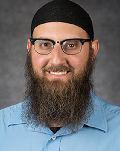 Headshot of Abdul-Malik Ryan
