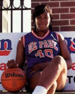 Portrait of Diana Vines sitting on a bench.